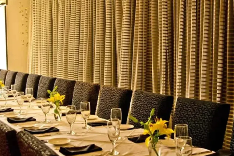 People like window seating especially if the window treatments are inviting like this full span treatment