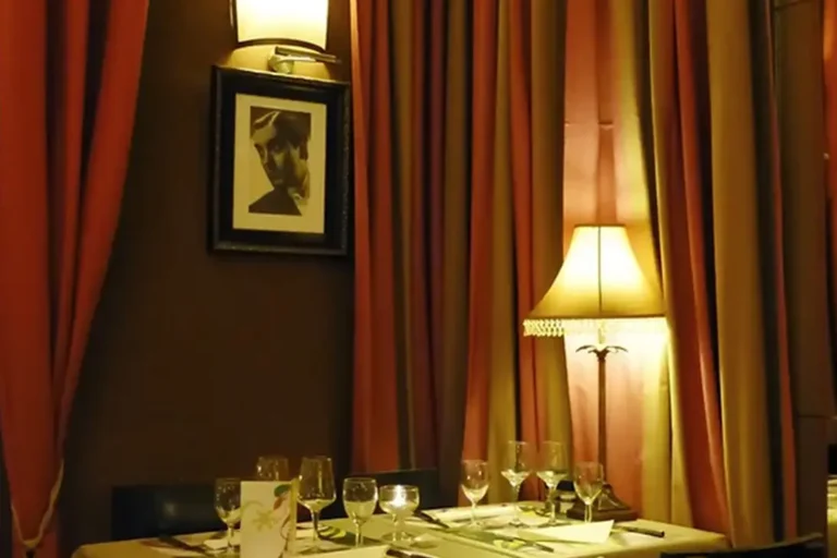 Restaurant table setting is more inviting with custom drapes and fabrics baked into the dining experience