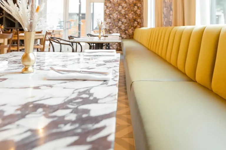 Sit down, cheers, an inviting bar with fabric and window treatments from MS Supply Co.