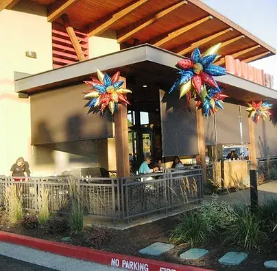 Exterior dining with automates shades extend to block the sun and wind and expand revenue potential.